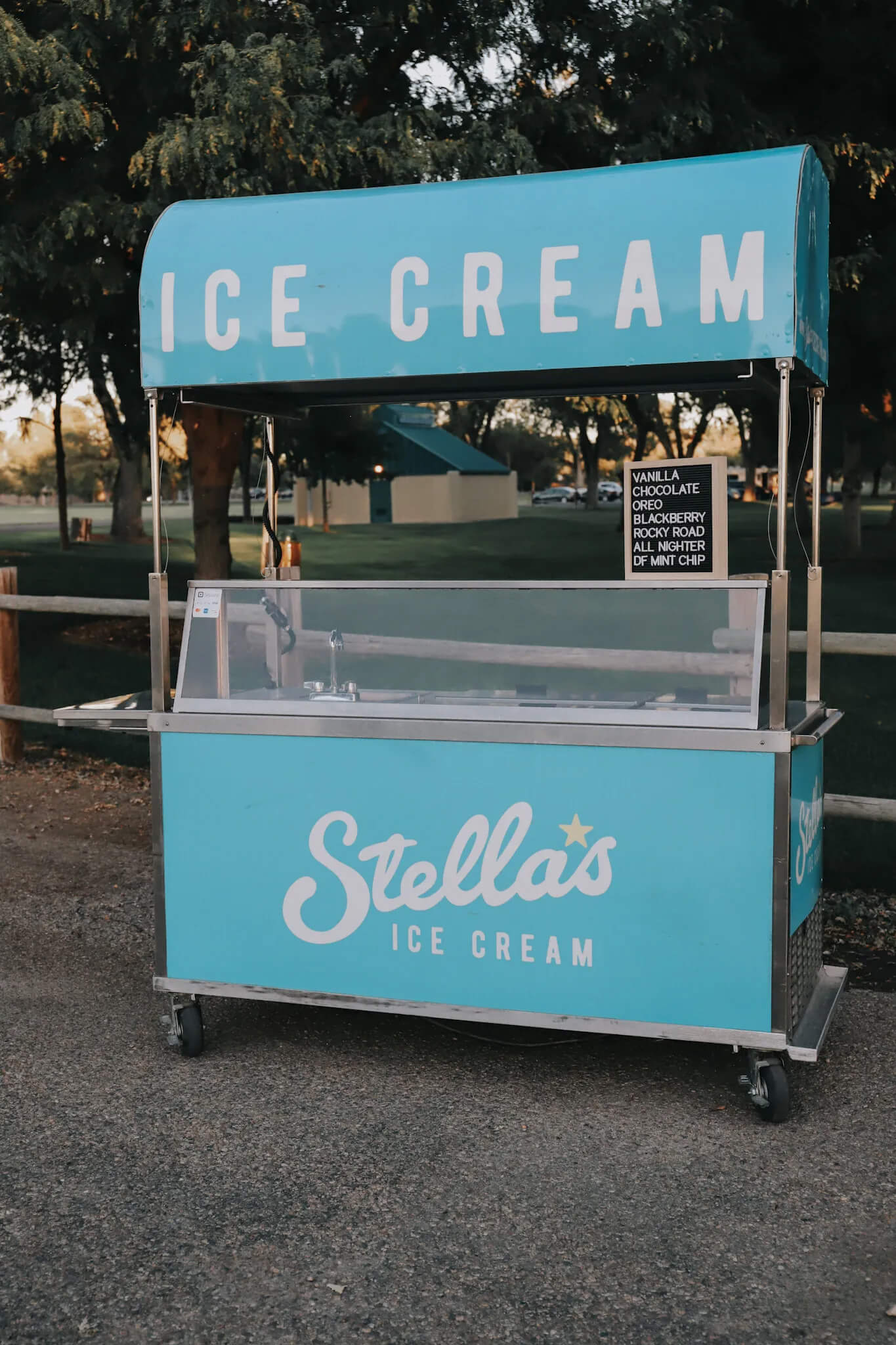 Stella's blue ice cream cart at a large event